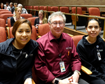 Dr. Christian with Interns Ciindi Montanya and Krystle Riojas at the Holly Auditorium